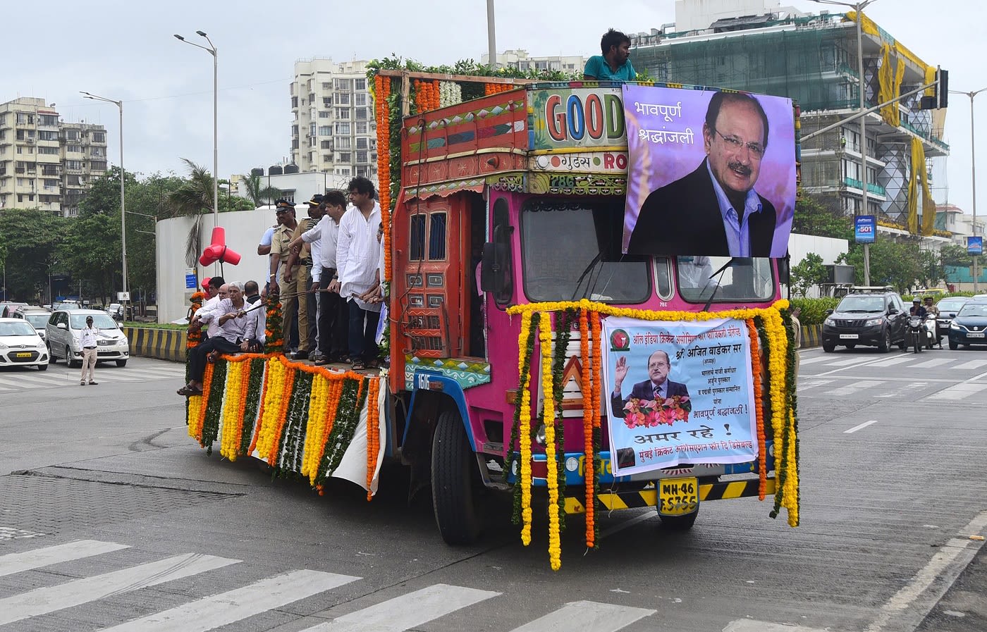 A truck carrying the body of Ajit Wadekar makes its way to a crematorium in Mumbai