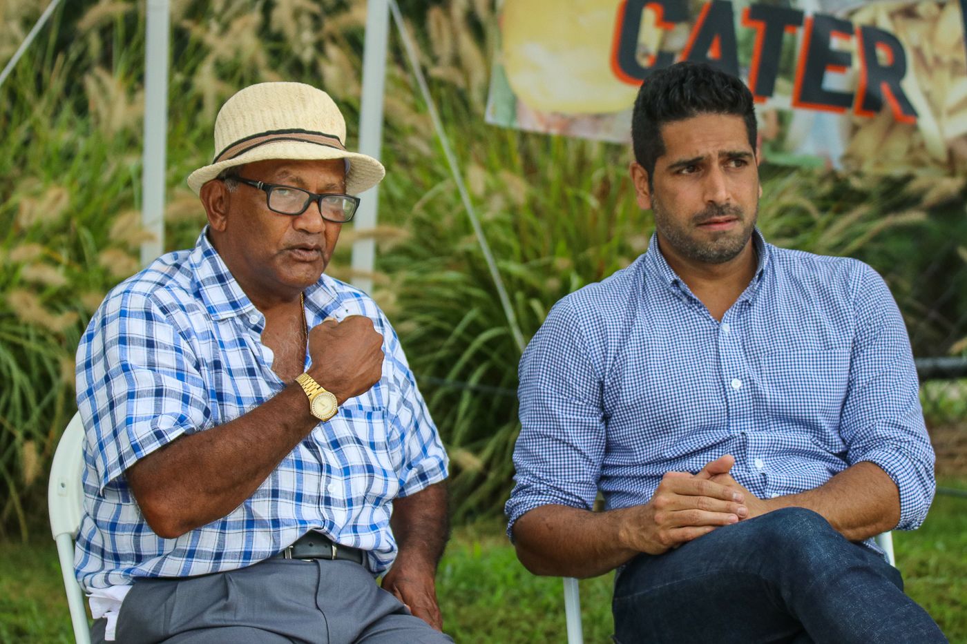 Alvin Kallicharran takes in the match with ICC Americas tournament director Zubin Surkari