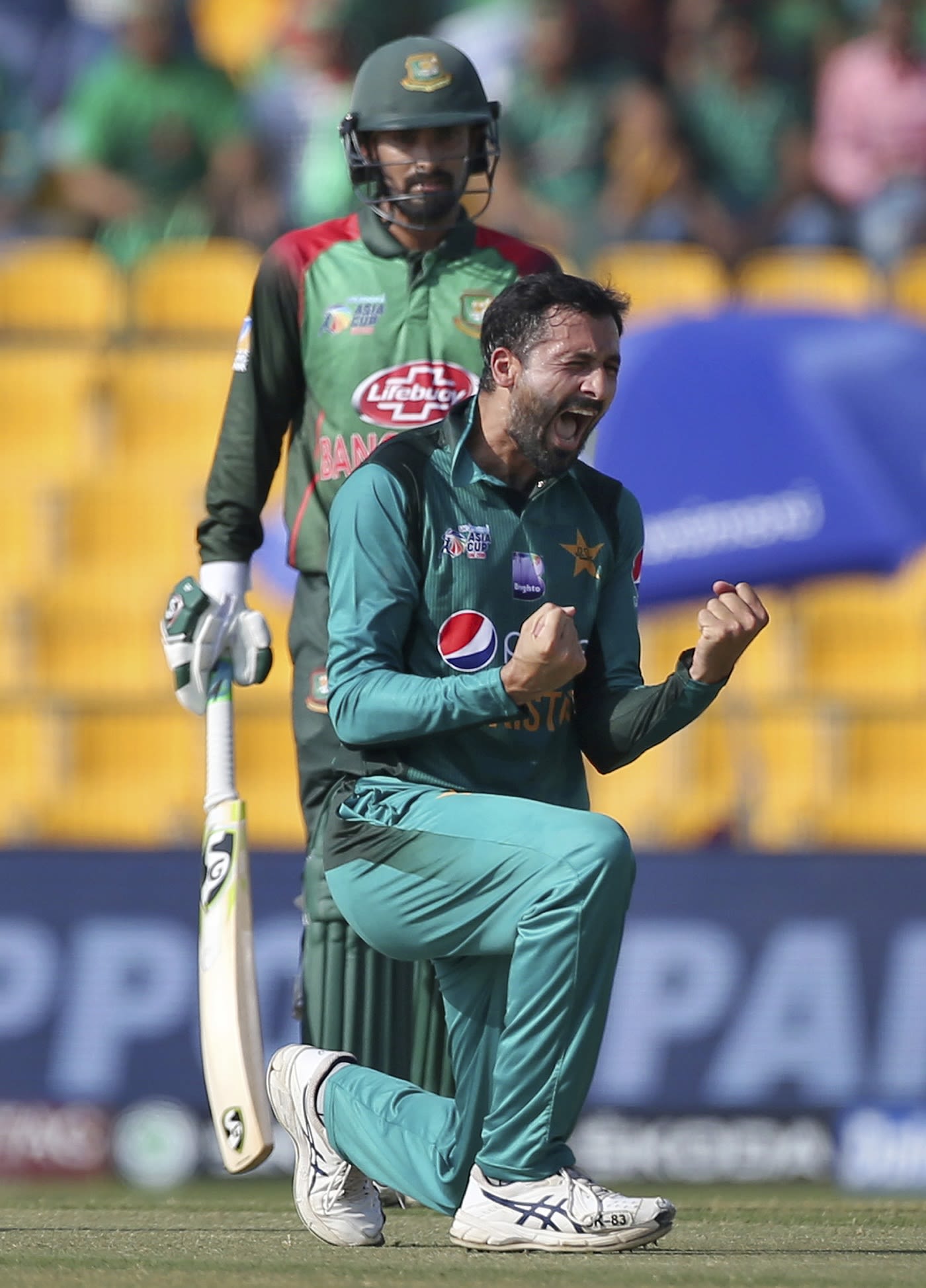 Junaid Khan celebrates a wicket