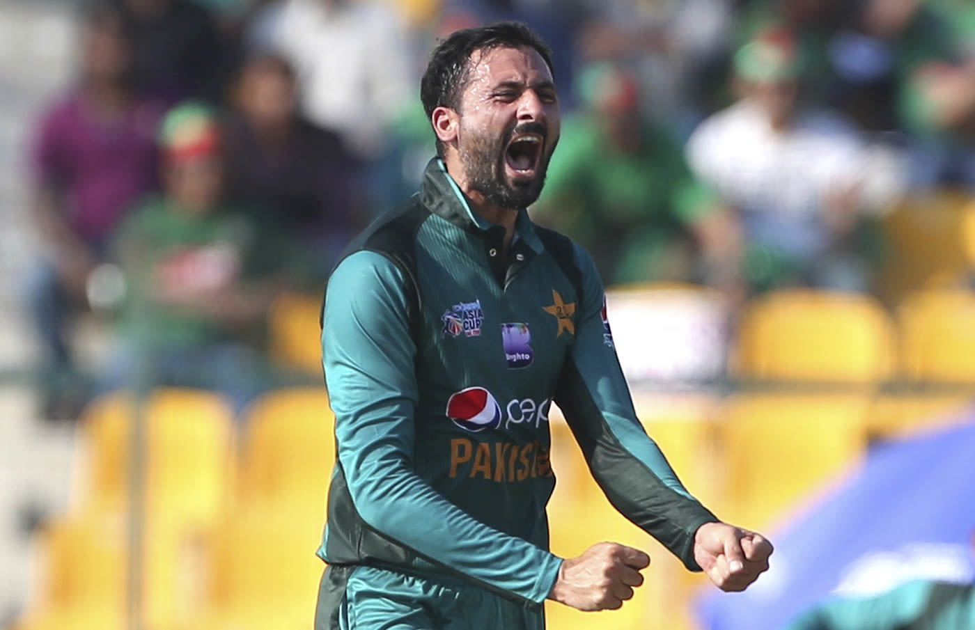 Junaid Khan is pumped up after taking a wicket