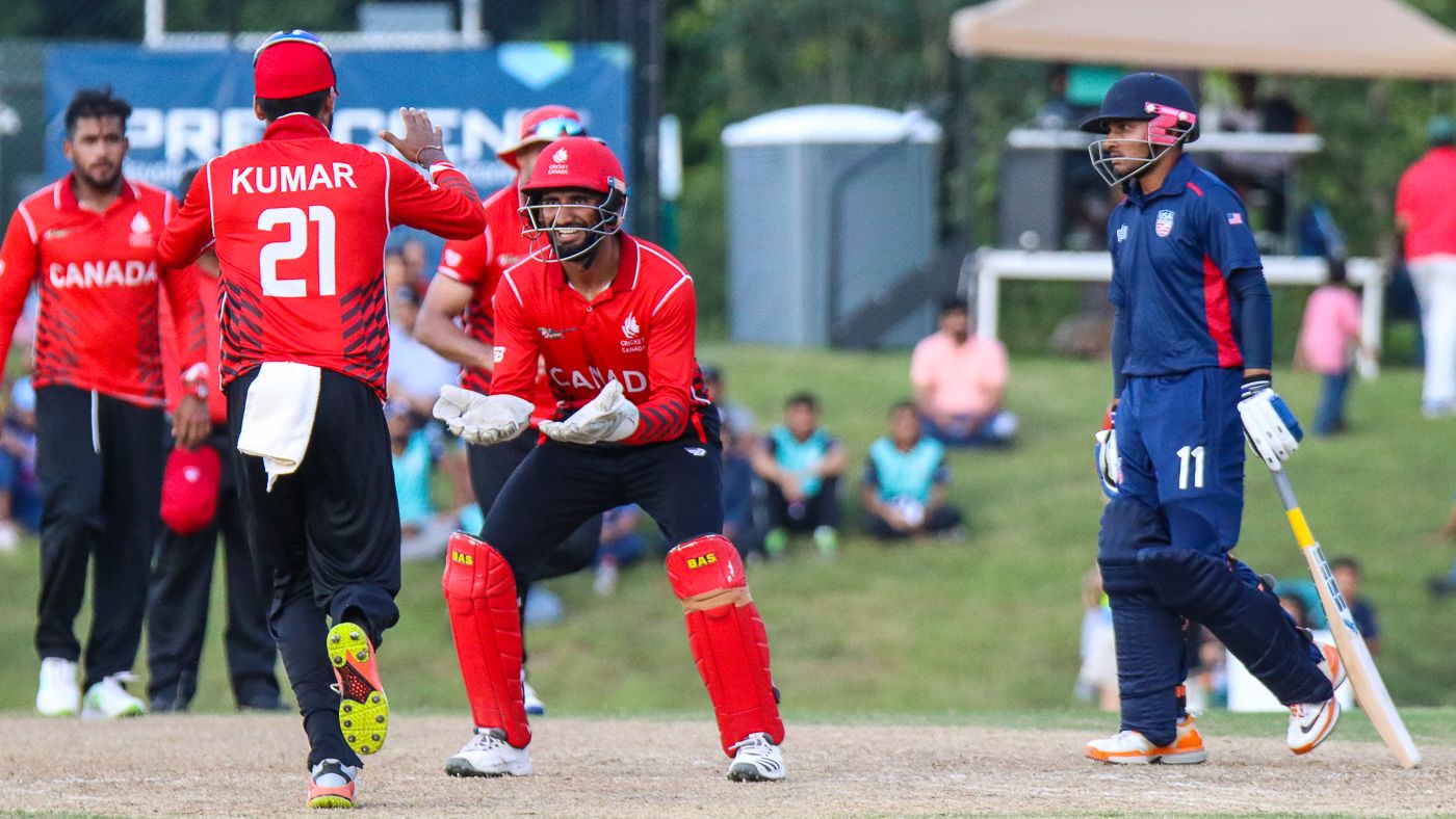 Nitish Kumar runs in to high five Hamza Tariq after teaming up to run out Timil Patel