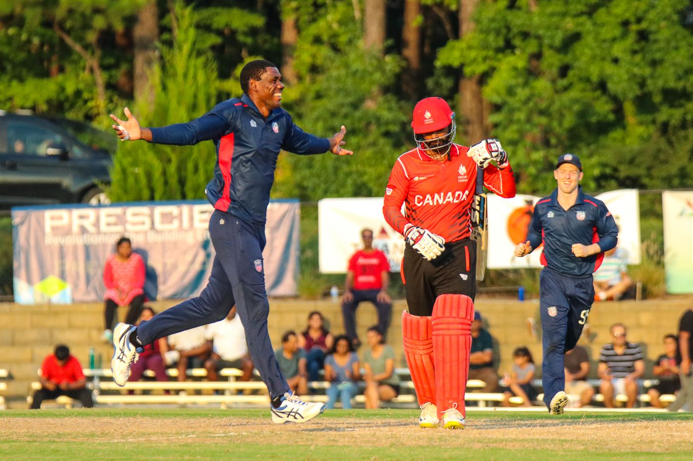 Elmore Hutchinson celebrates after bowling Navneet Dhaliwal