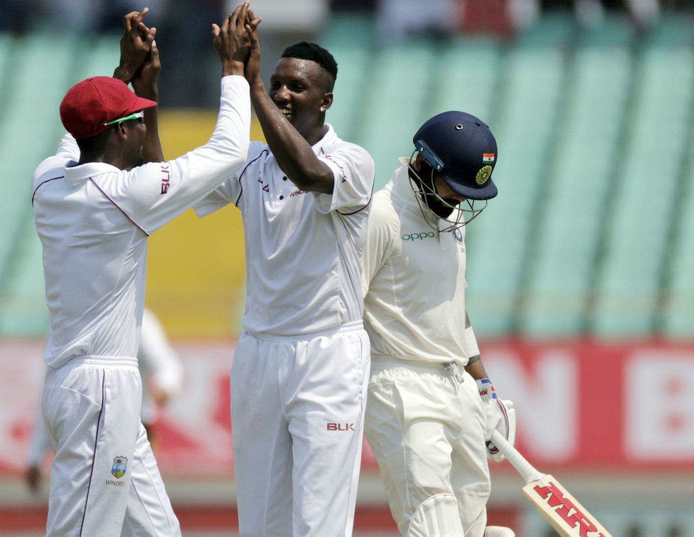 Virat Kohli toe-ended a lofted hit to give Sherman Lewis his second wicket