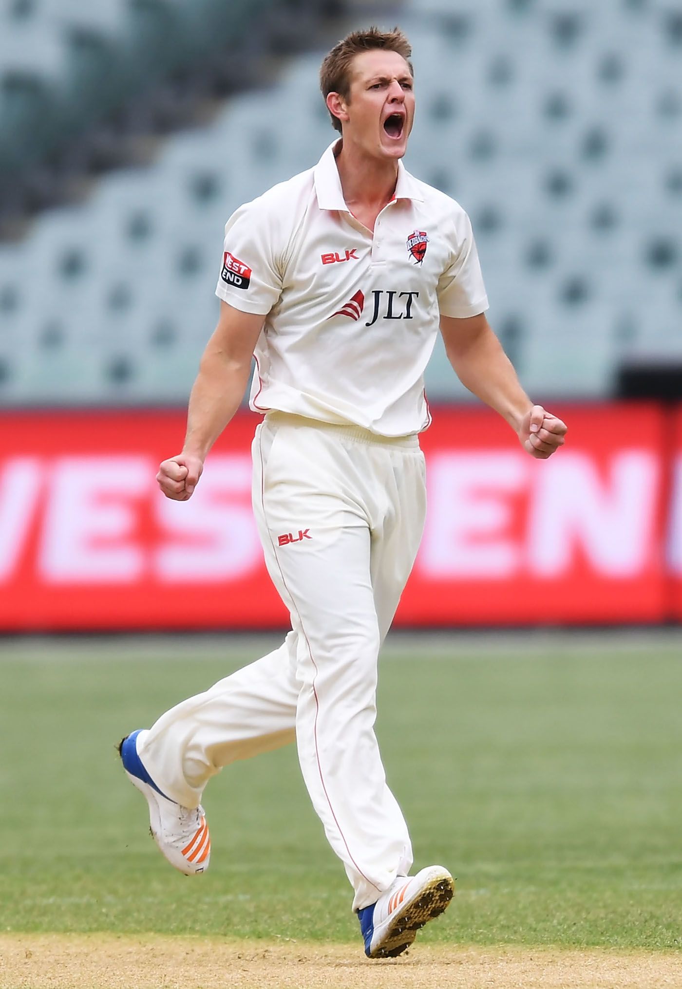 Joe Mennie is thrilled after taking a wicket