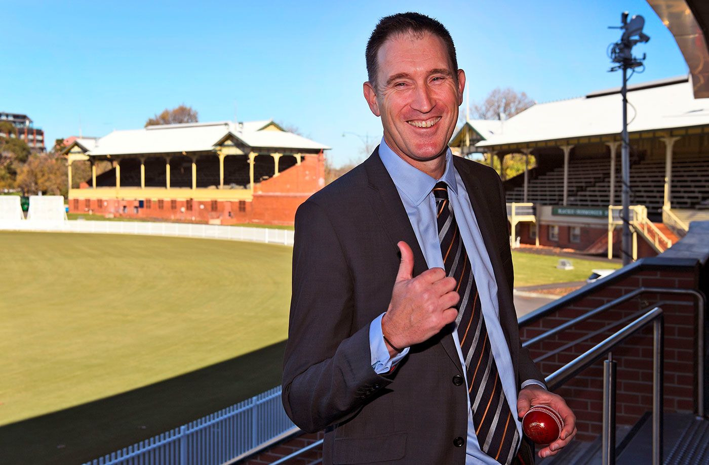 James Sutherland gives a thumbs-up sign to reporters after announcing his decision to step down as Cricket Australia CEO