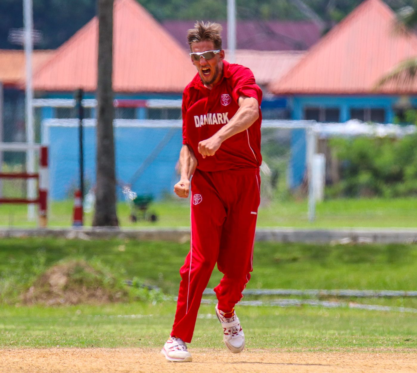 Nicolaj Laegsgaard erupts after taking a wicket