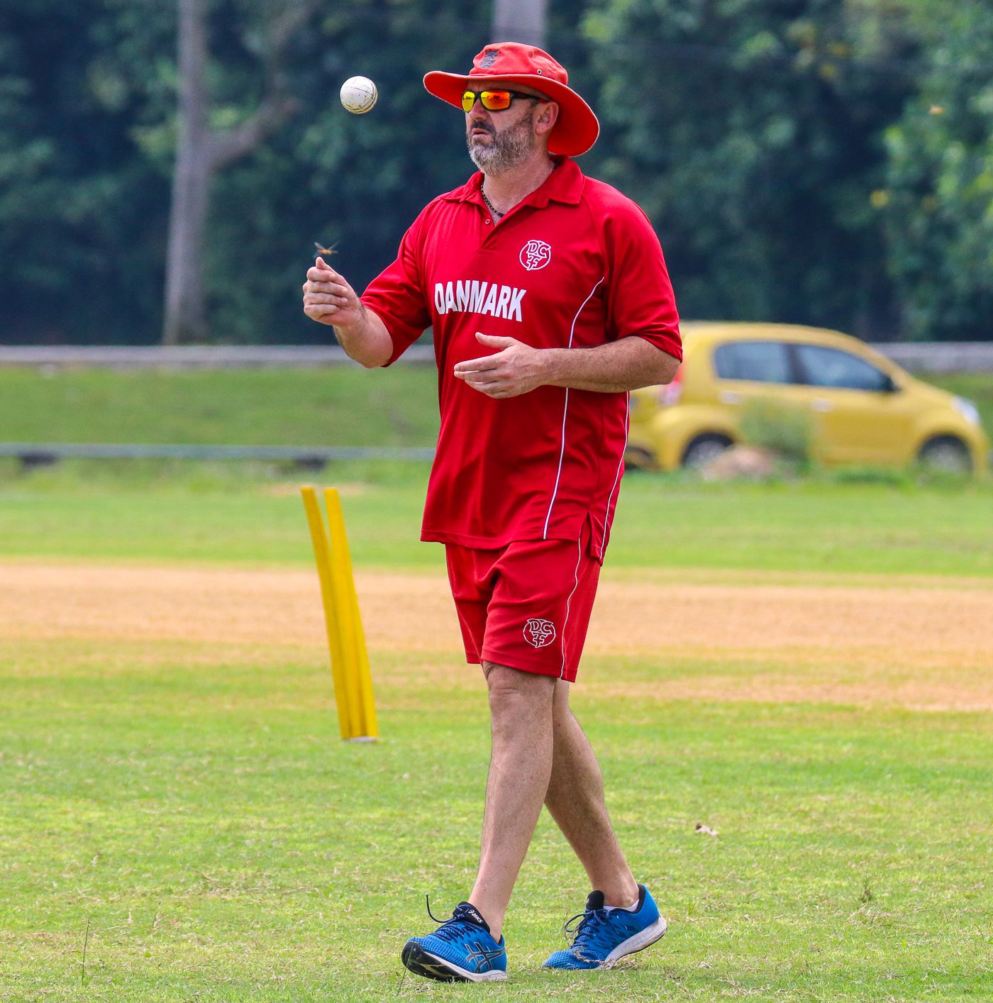 Denmark coach Jeremy Bray flicks a ball in the air as he gets set to begin warmups