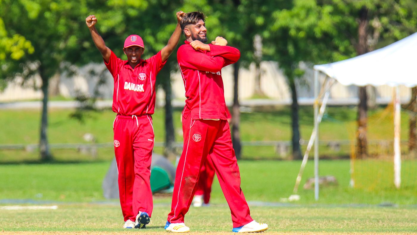 Saif Ahmad signs an 'X' to cross another wicket off his bowling