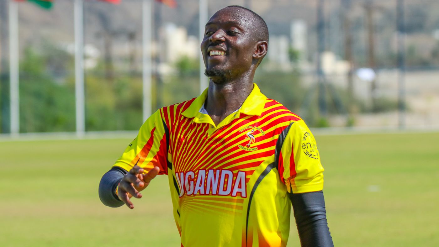 Charles Waiswa leads the team off the field after a brilliant spell