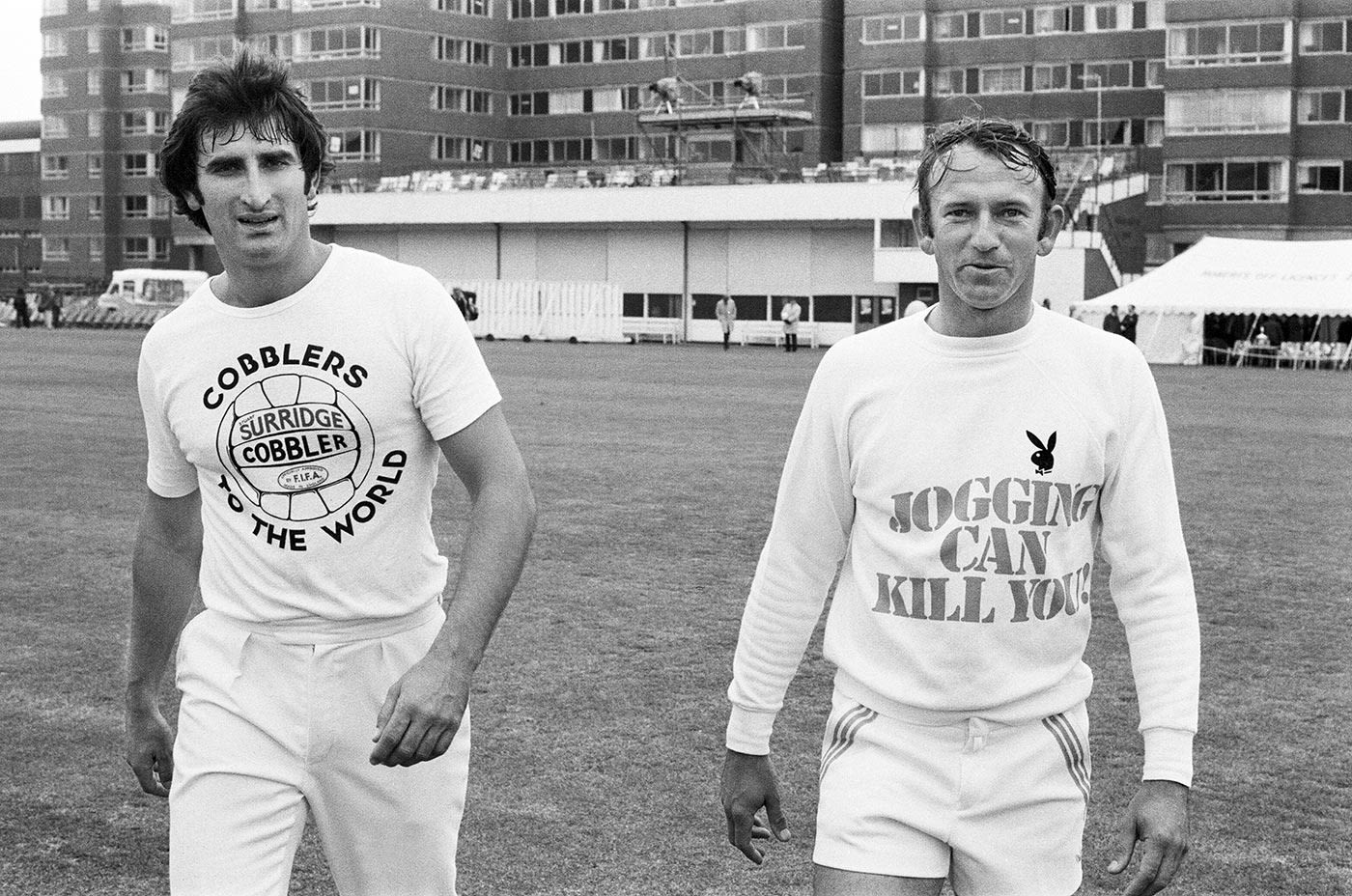 Len Pascoe and Doug Walters after a game of football