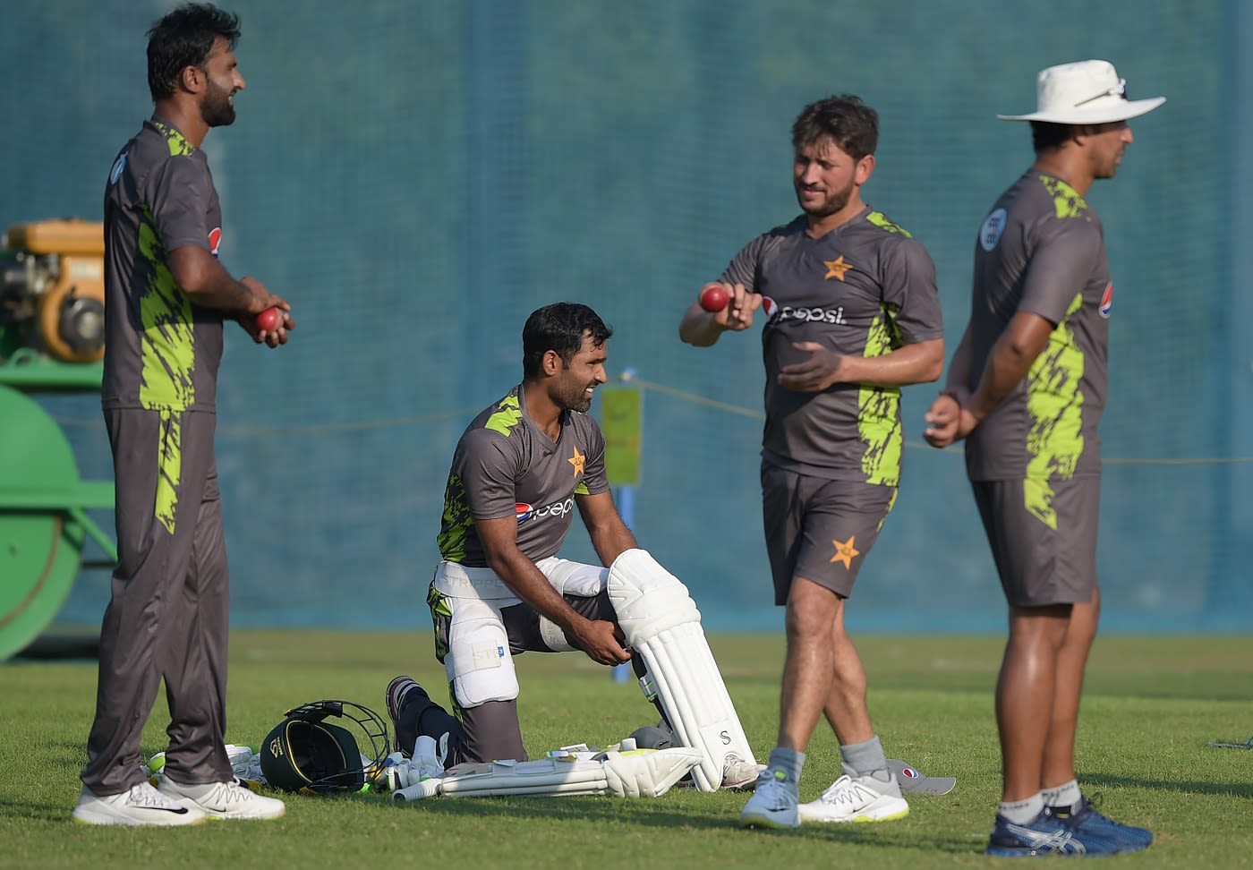Yasir Shah and Bilal Asif go through bowling drills as Asad Shafiq watches