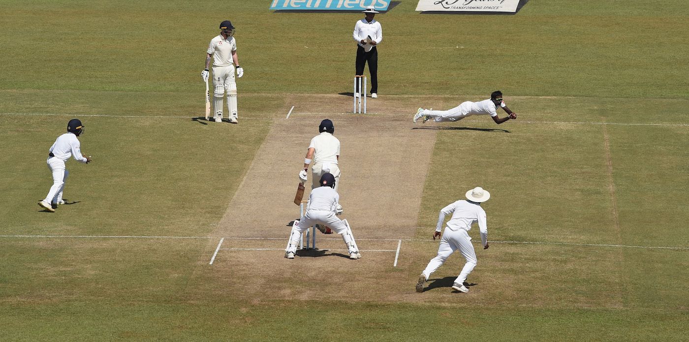 Malinda Pushpakumara dives to catch Joe Root