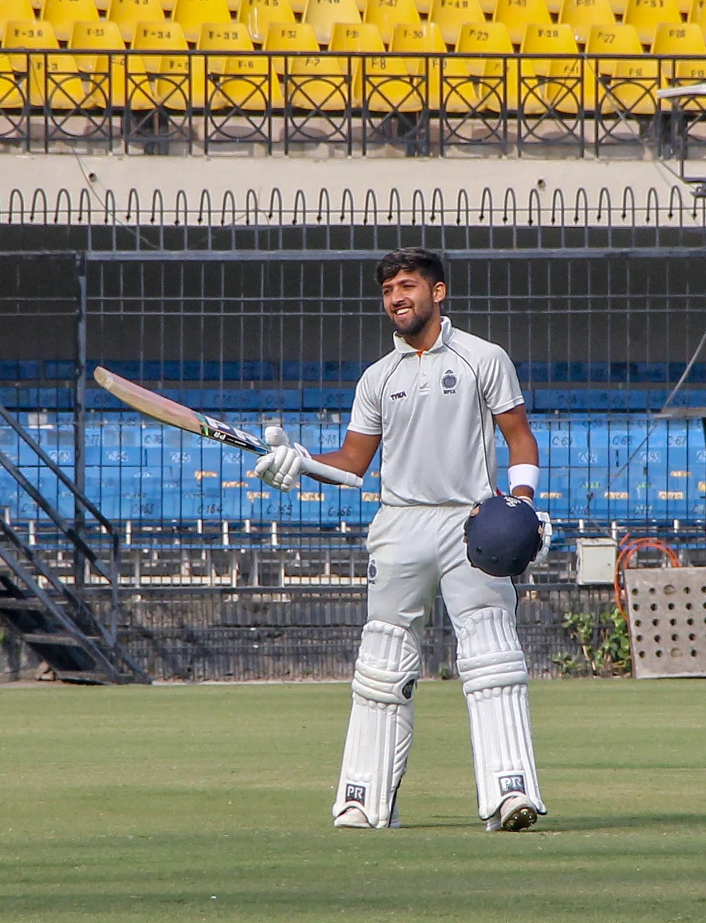 Ajay Rohera acknowledges the applause after hitting 267* on debut