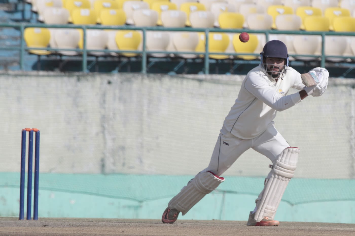 Raghav Dhawan punches the ball