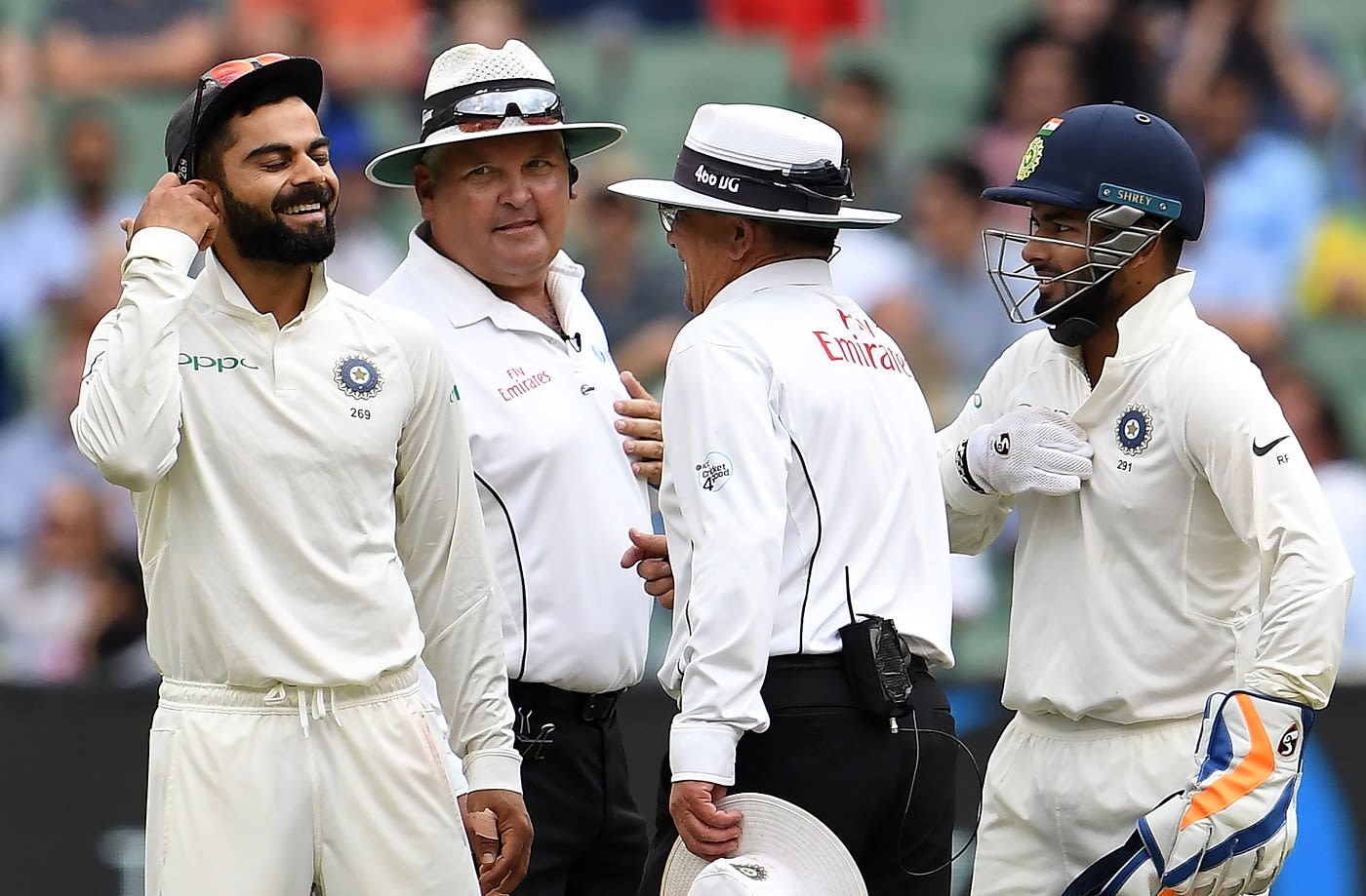 Virat Kohli, Rishabh Pant, Marais Erasmus and Ian Gould share a lighter moment