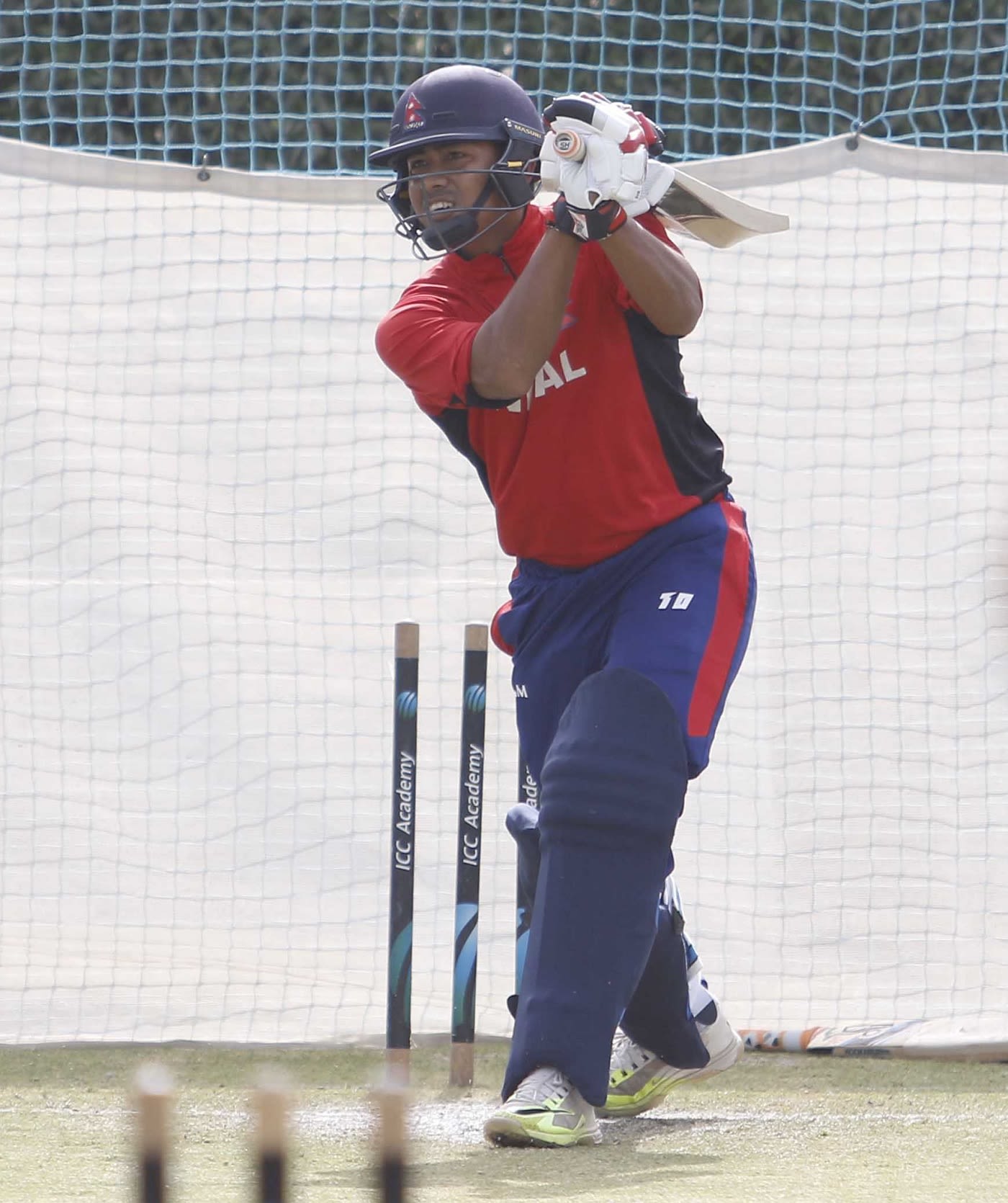 Gyanendra Malla plays a shot