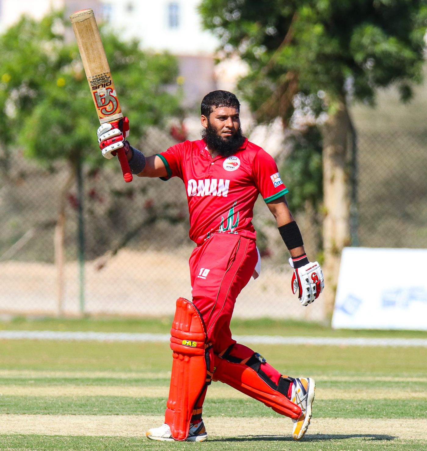 Khurram Nawaz salutes the home crowd after reaching his maiden T20I fifty