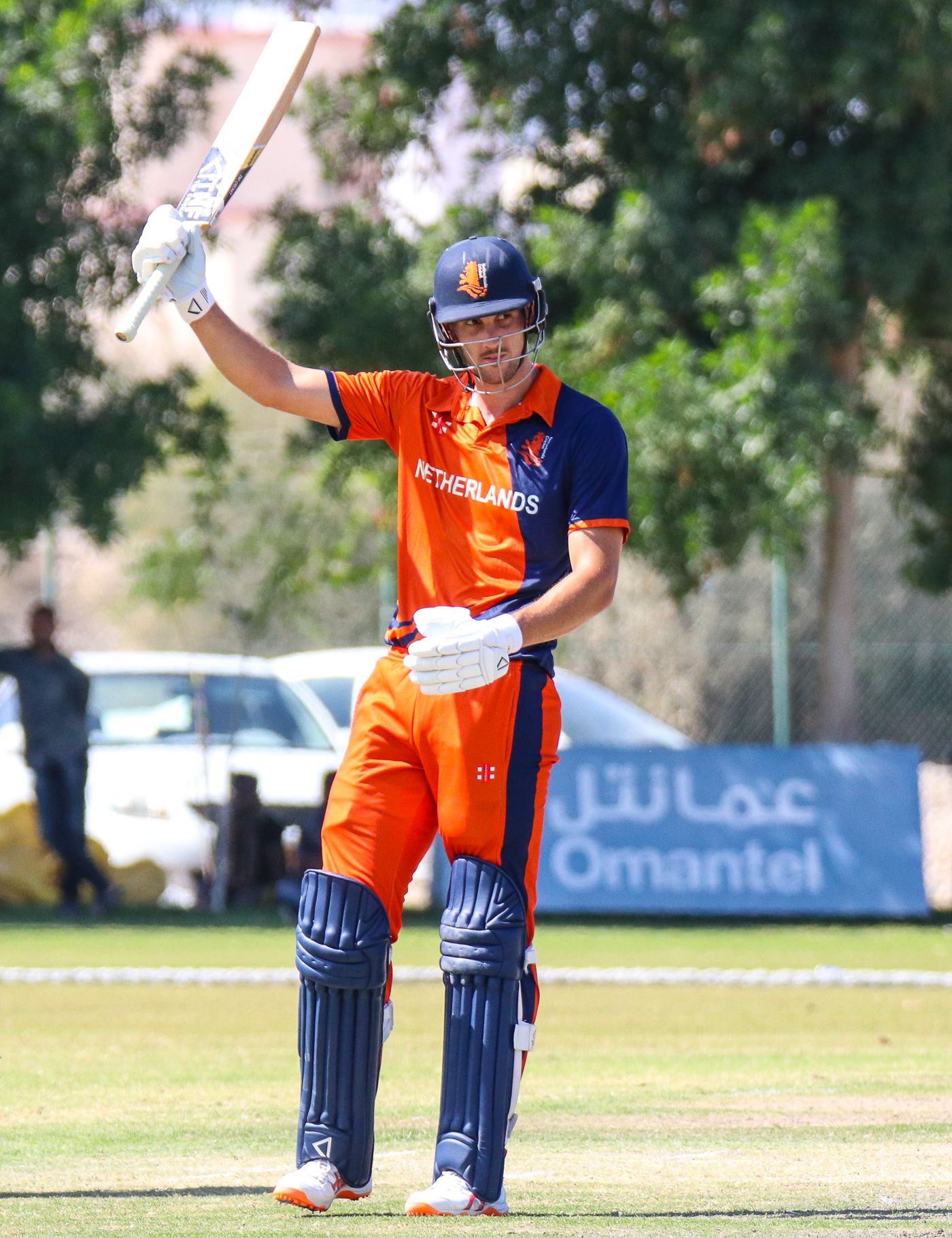 Ben Cooper raises his bat to acknowledge his half-century