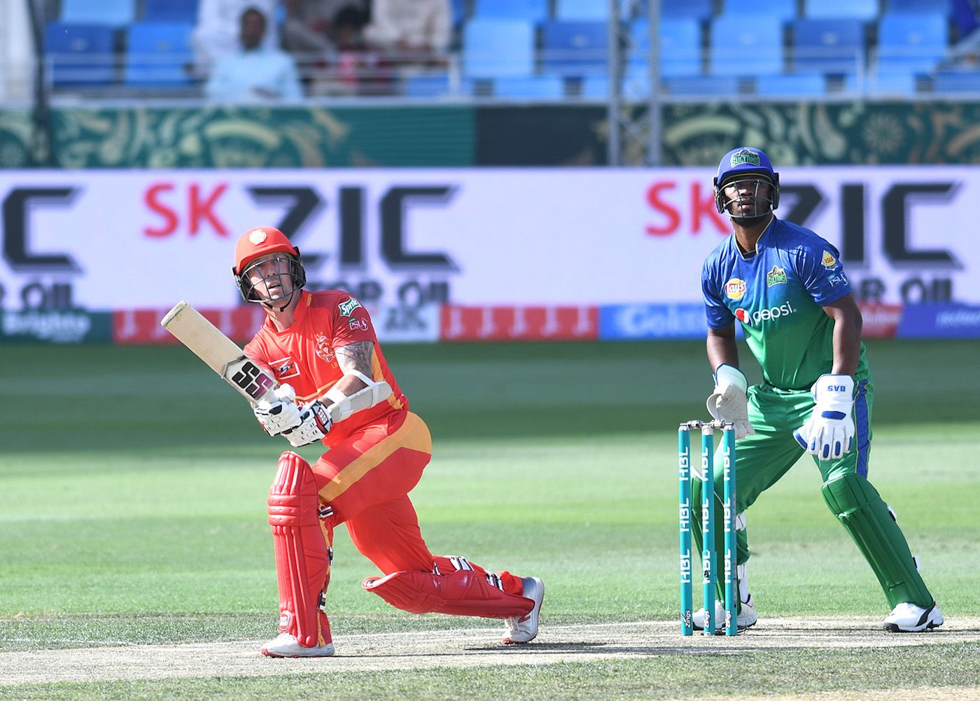 Luke Ronchi takes the aerial route on the leg side