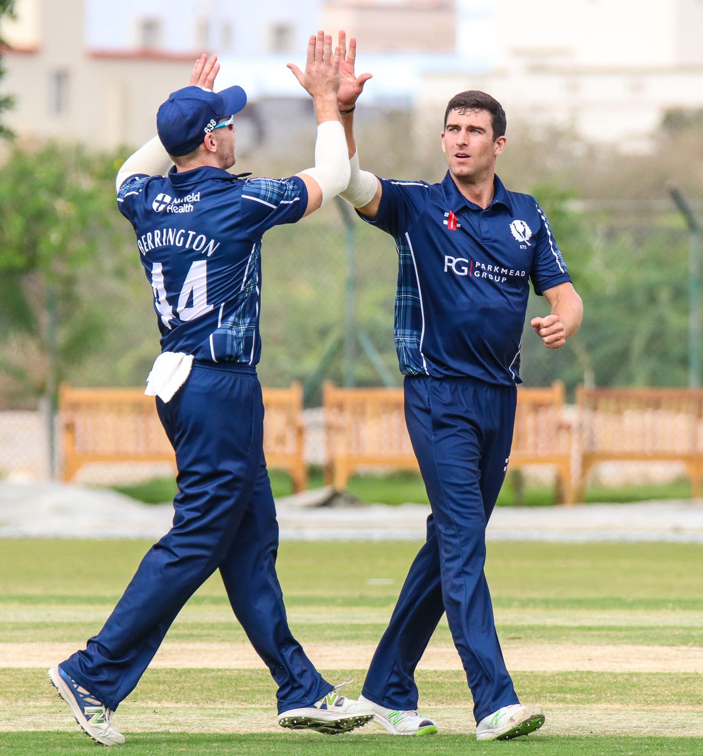 Ruaidhri Smith gets a high five after taking another wicket