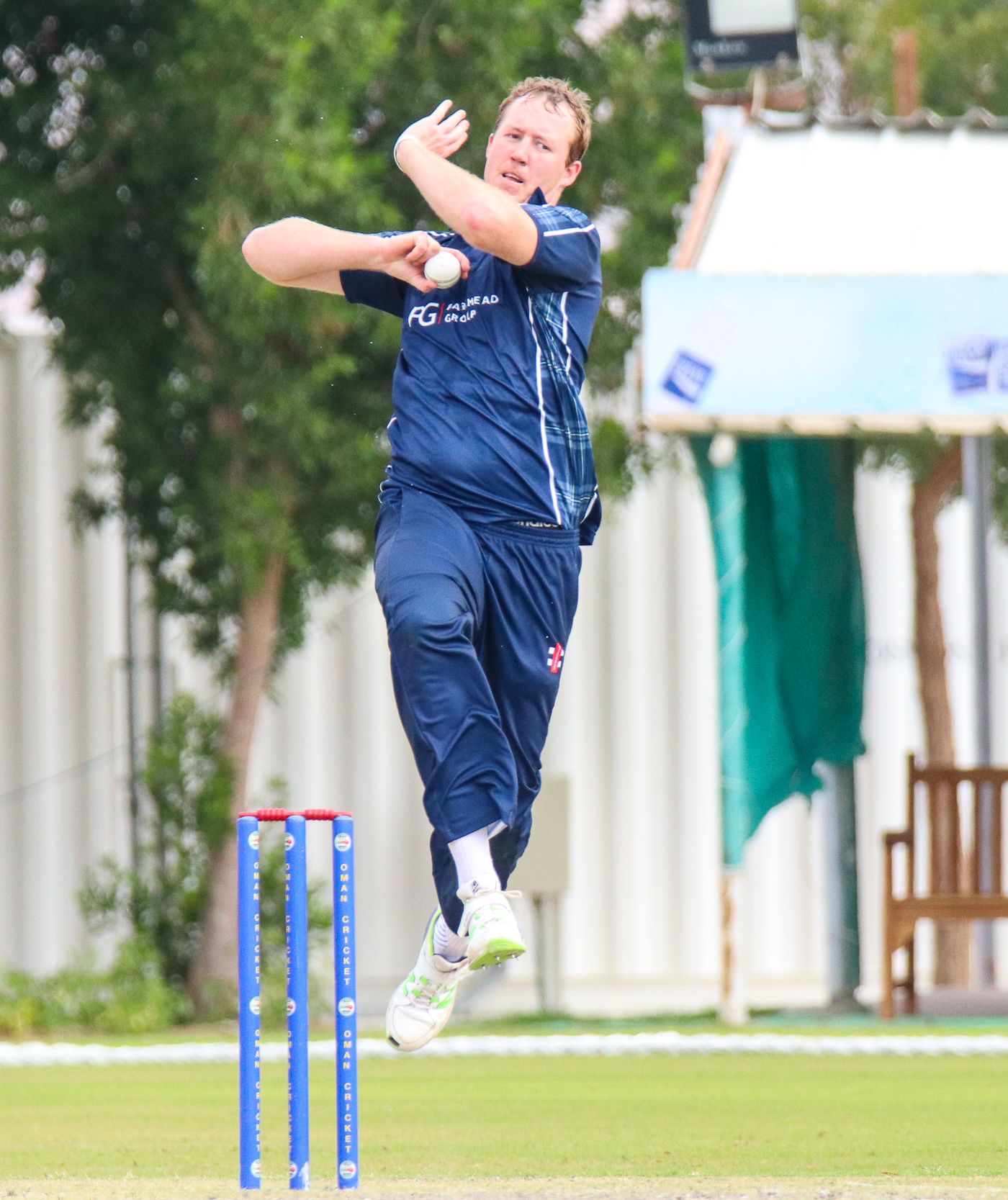 At 6'9", Adrian Neill is an imposing figure as he leaps into his delivery stride