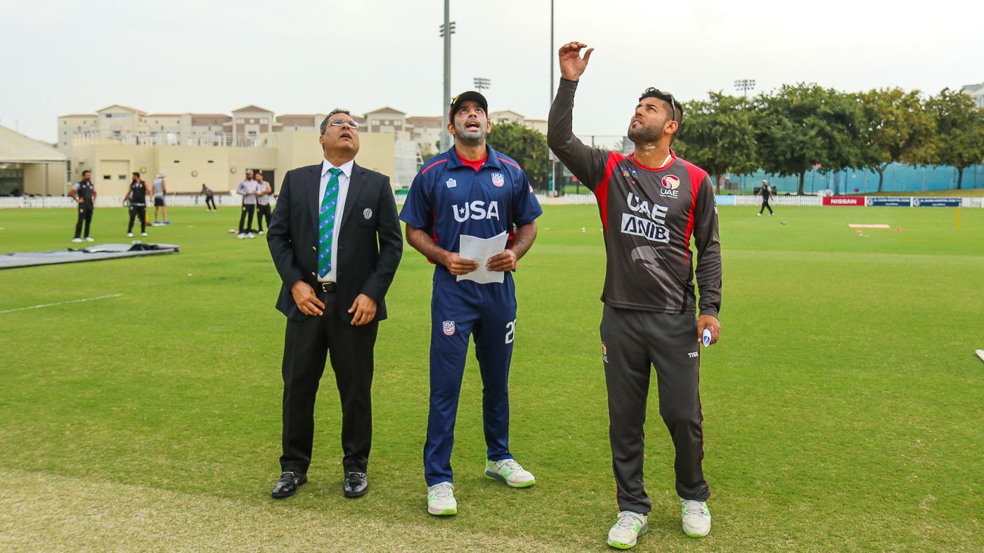 USA captain Saurabh Netravalkar calls heads as it lands tails at the toss for USA's maiden T20I