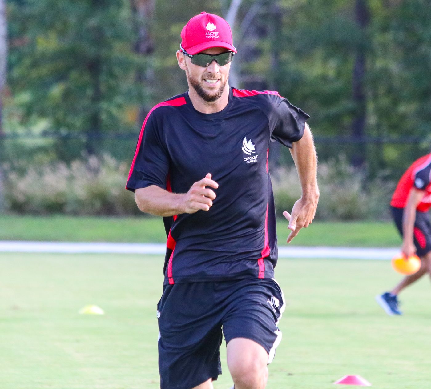 Davy Jacobs goes through a warm-up sprint in a Canada training session