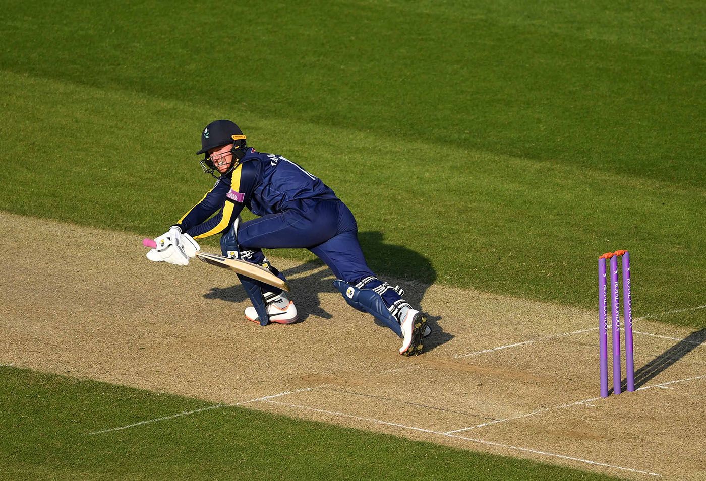 Jonny Tattersall sweeps during his half-century