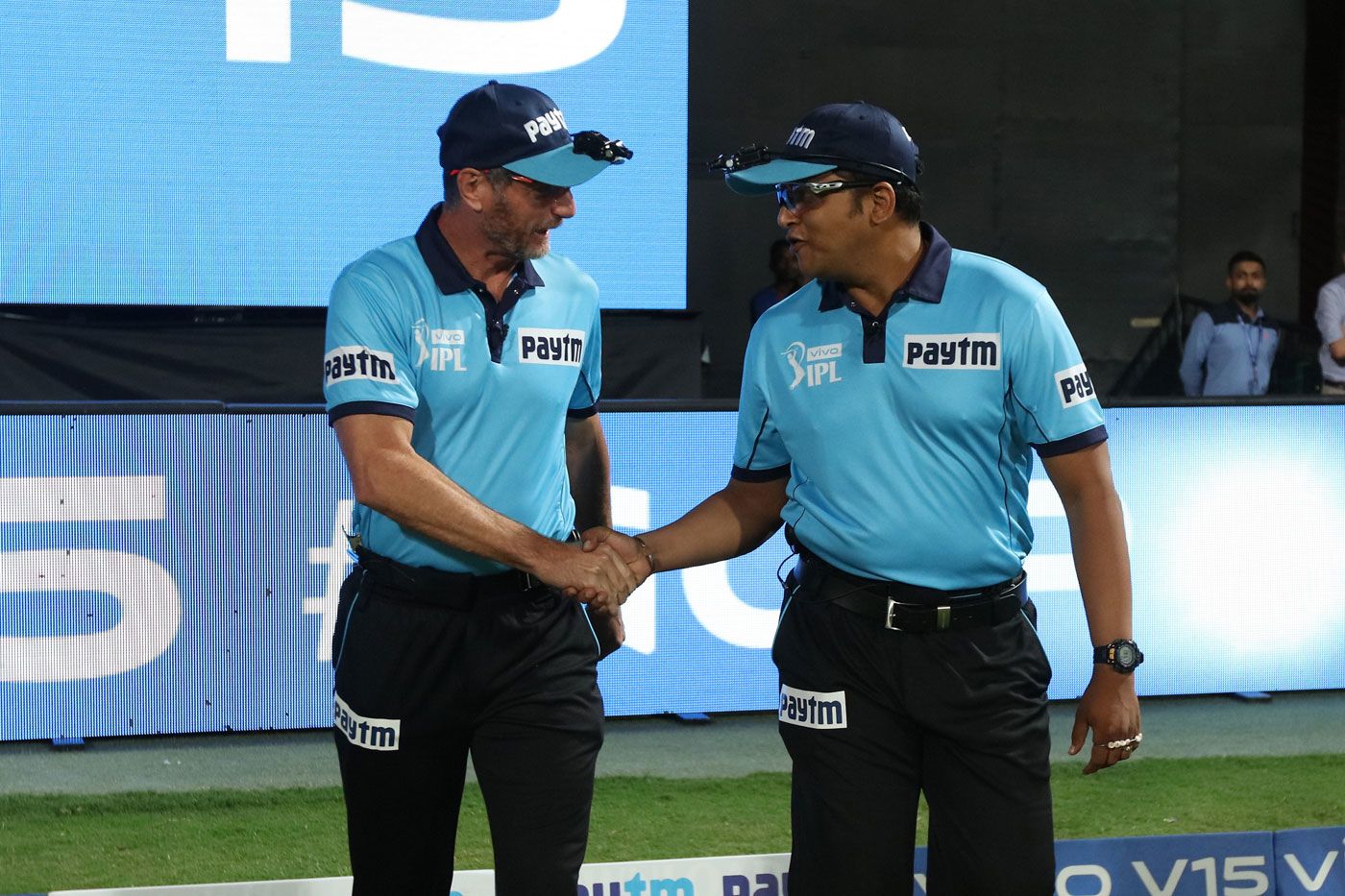 Rod Tucker and Vineet Kulkarni walk out onto the field