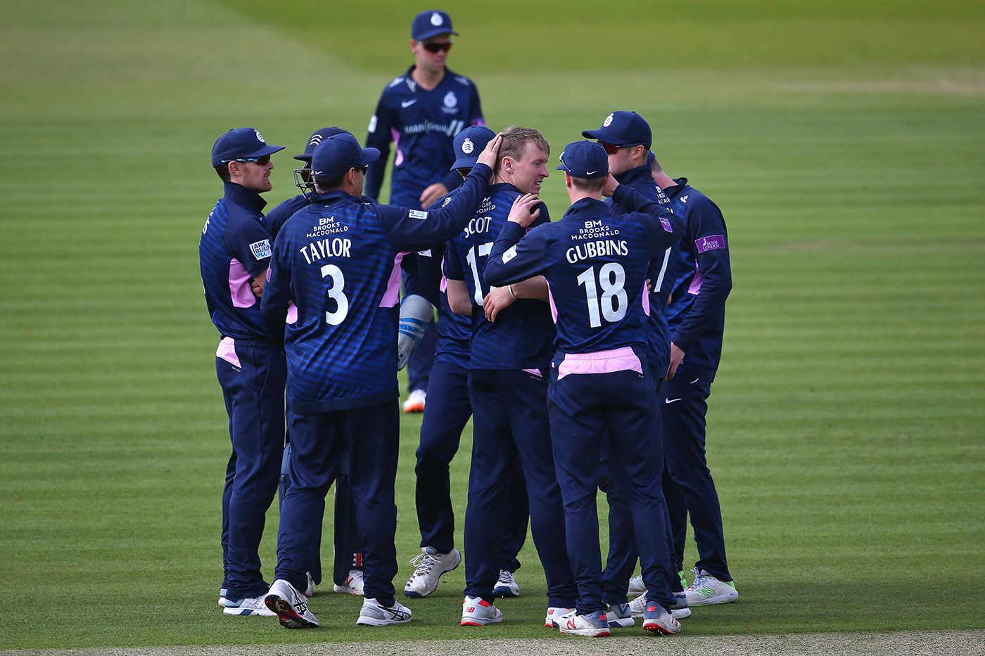 George Scott celebrates with his team-mates