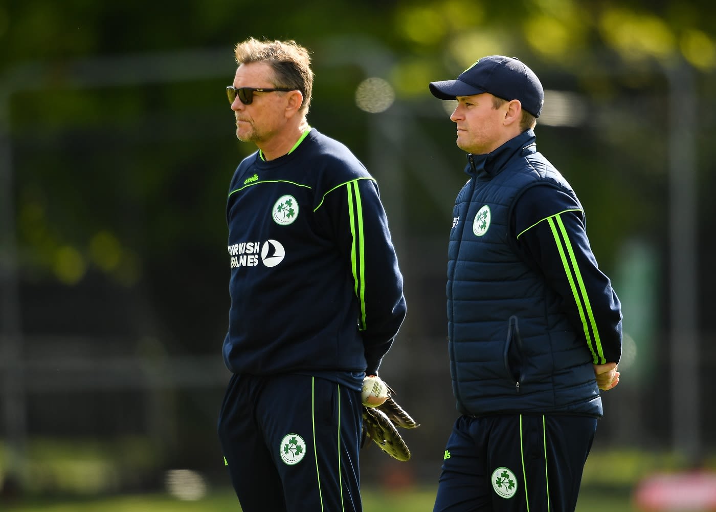 Graham Ford and William Porterfield look on at training