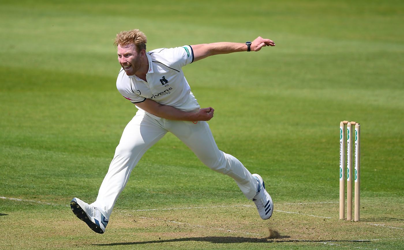 Liam Norwell of Warwickshire on his way to a seven-wicket haul