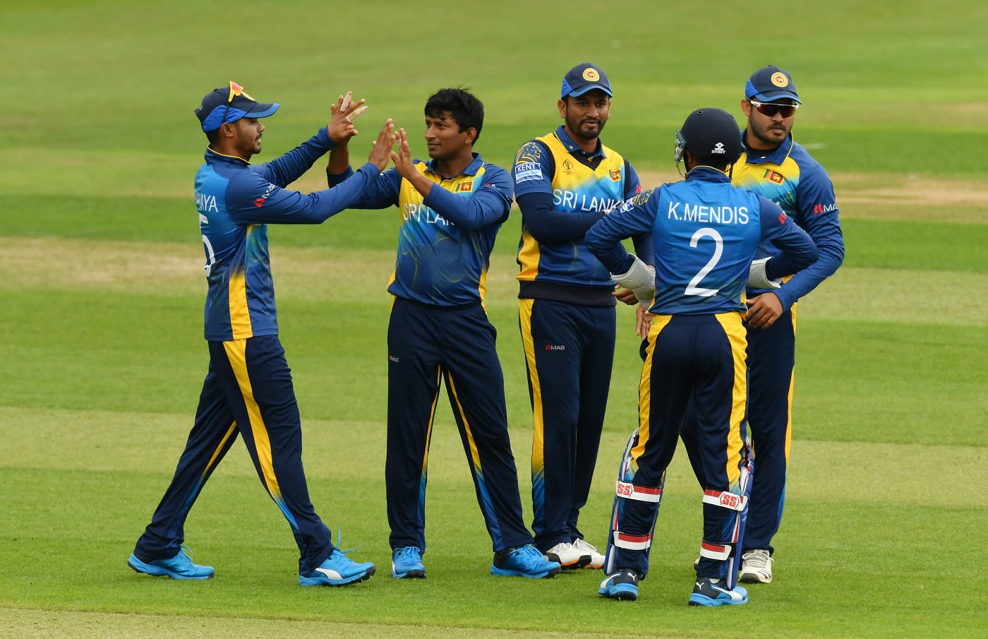 Jeevan Mendis is congratulated by his team-mates