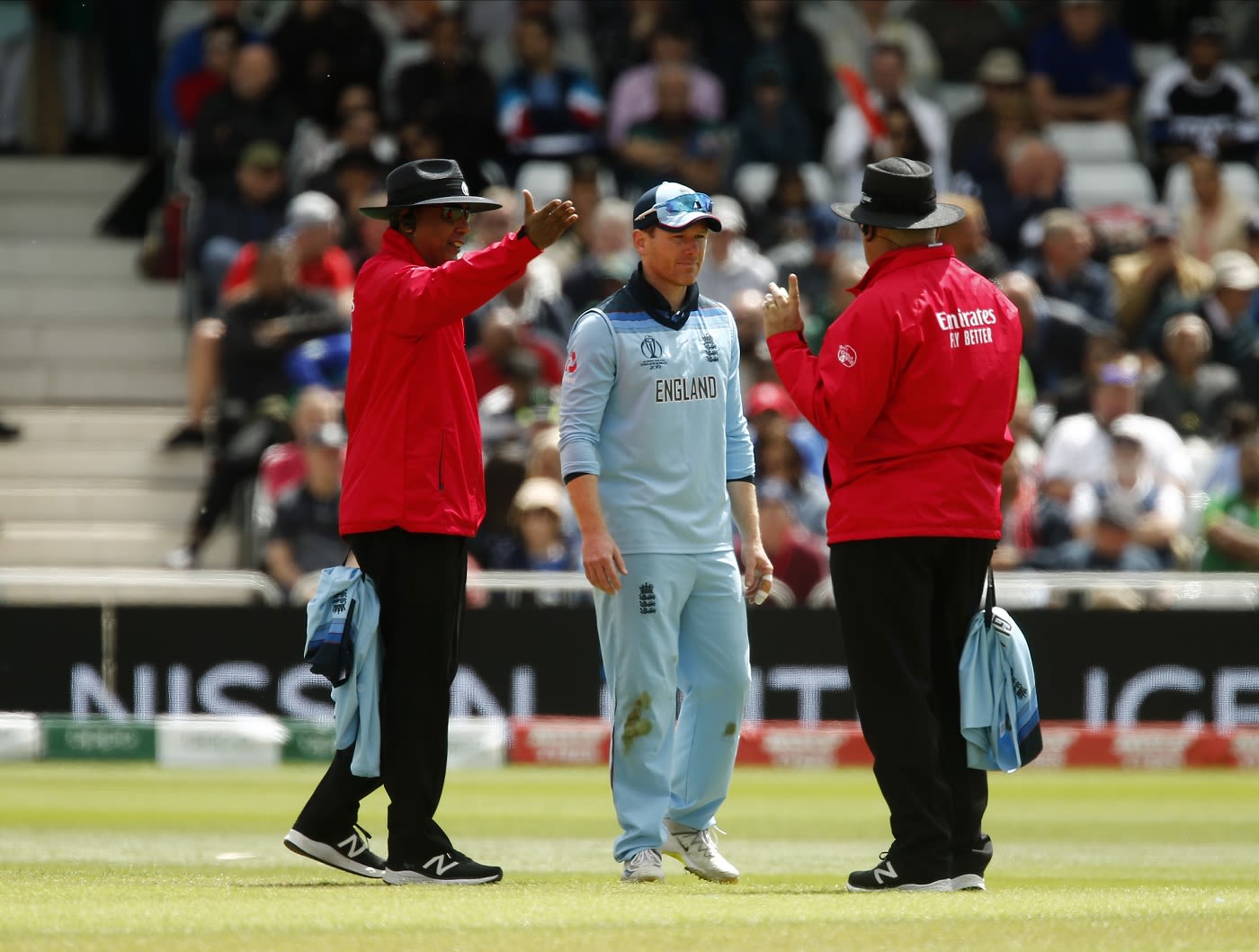 S Ravi and Marais Erasmus having a word with Eoin Morgan