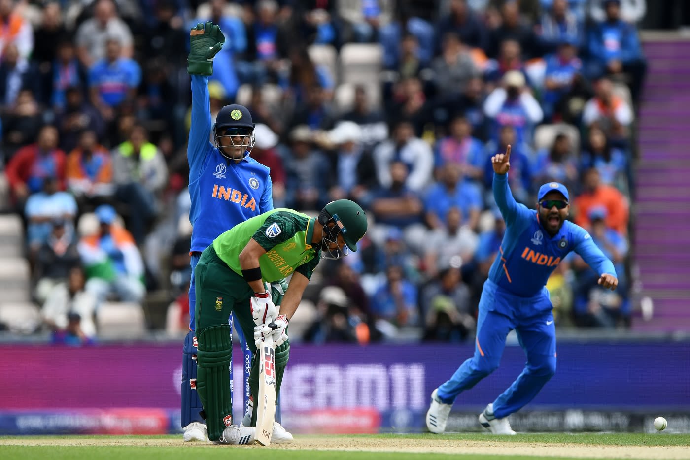 MS Dhoni and Rohit Sharma appeal for an LBW dismissal against JP Duminy