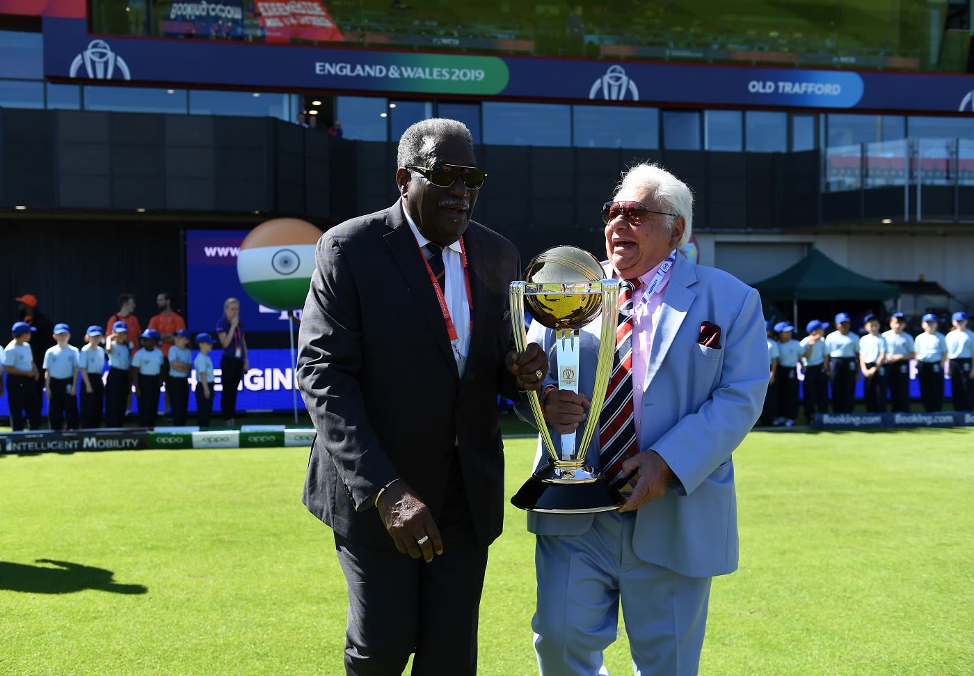 Clive Lloyd and Farokh Engineer carry out the trophy prior to the national anthems