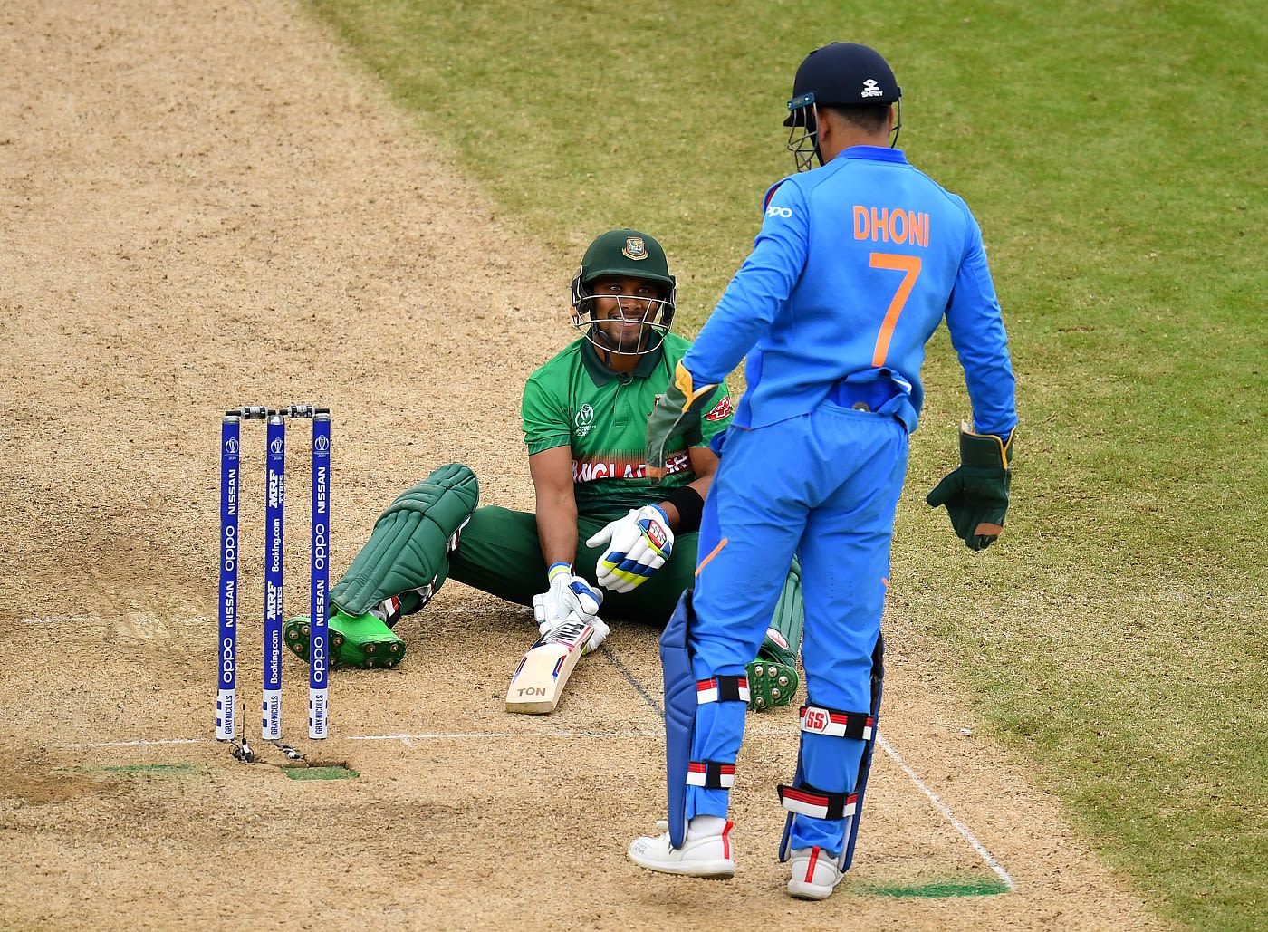 Sabbir Rahman slips, but can see the lighter side of the moment along with MS Dhoni