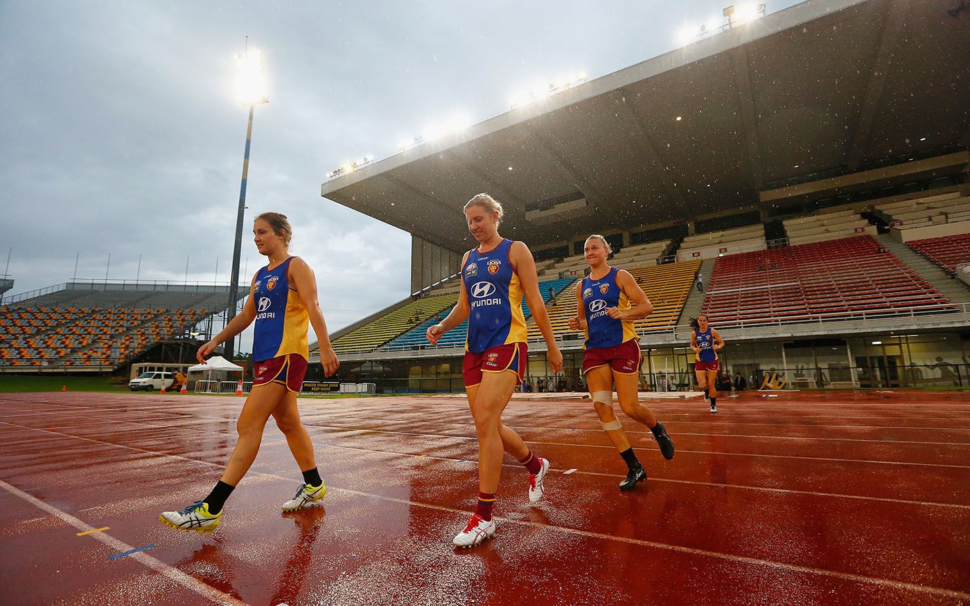Delissa Kimmince walks out to train with some of her Brisbane Lions AFL Women's team-mates