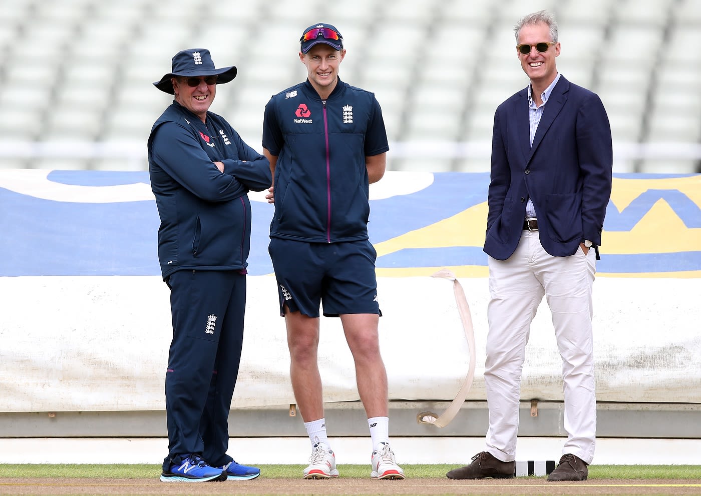 England coach Trevor Bayliss, captain Joe Root and ECB national selector, Ed Smith watch the side train