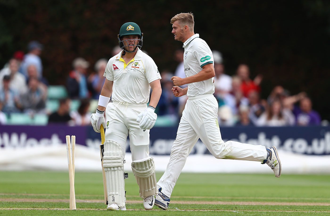 Adam Finch celebrates after bowling Marcus Harris