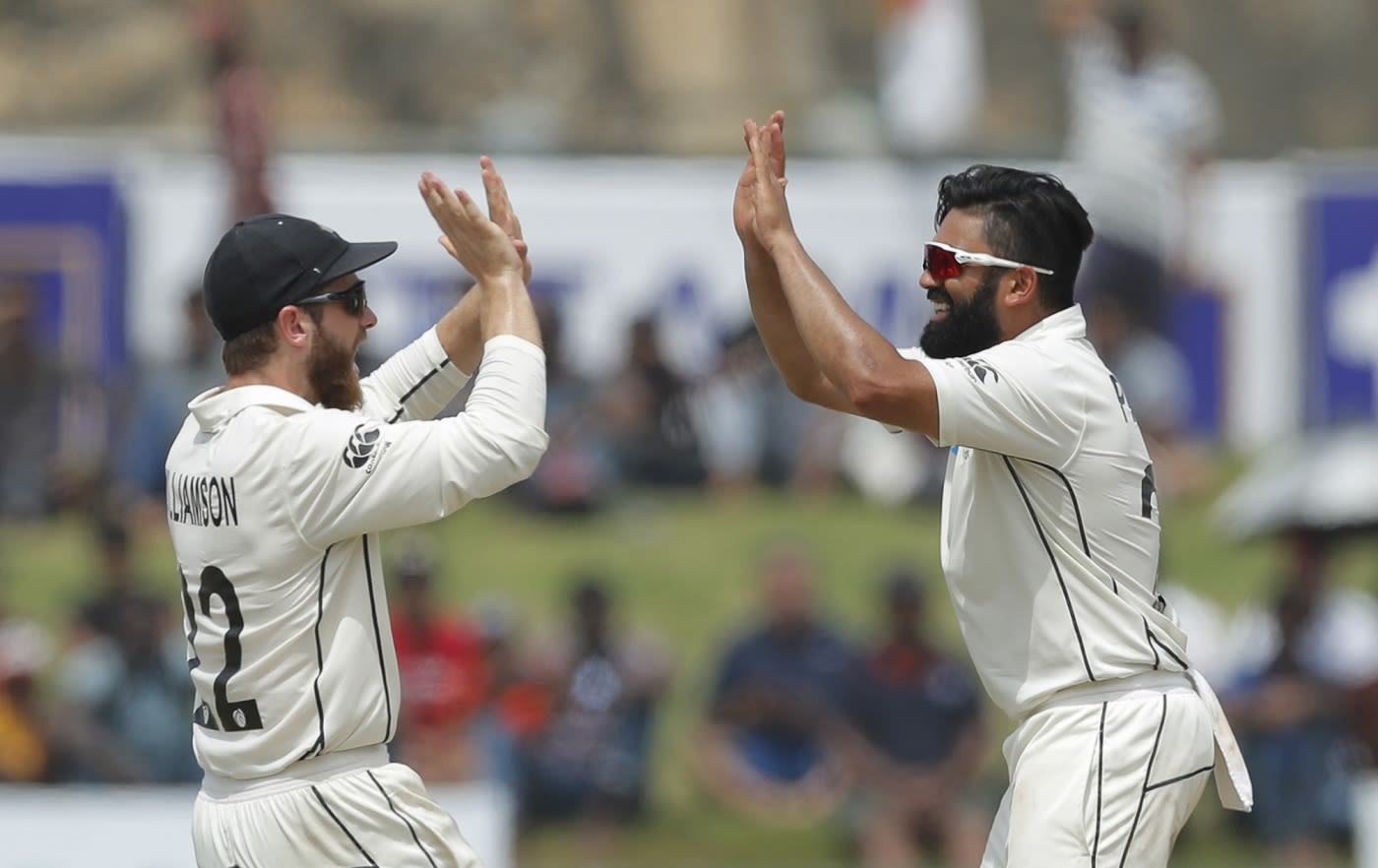 Ajaz Patel celebrates a wicket with Kane Williamson