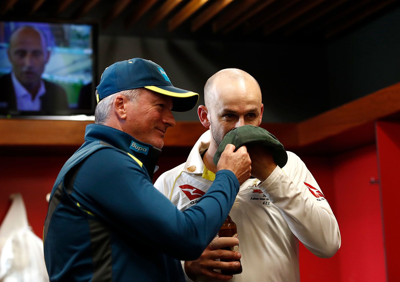 Nathan Lyon and Steve Waugh hold up a baggy green