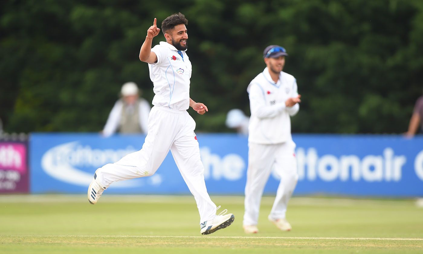 Anuj Dal of Derbyshire celebrates as he gets Australia's Usman Khawaja out during a Tour match