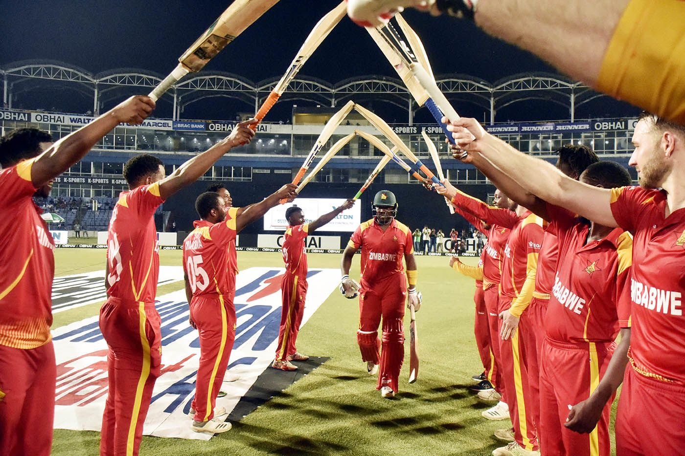 Hamilton Masakadza walks out to a guard of honour in his final match in Zimbabwe colours