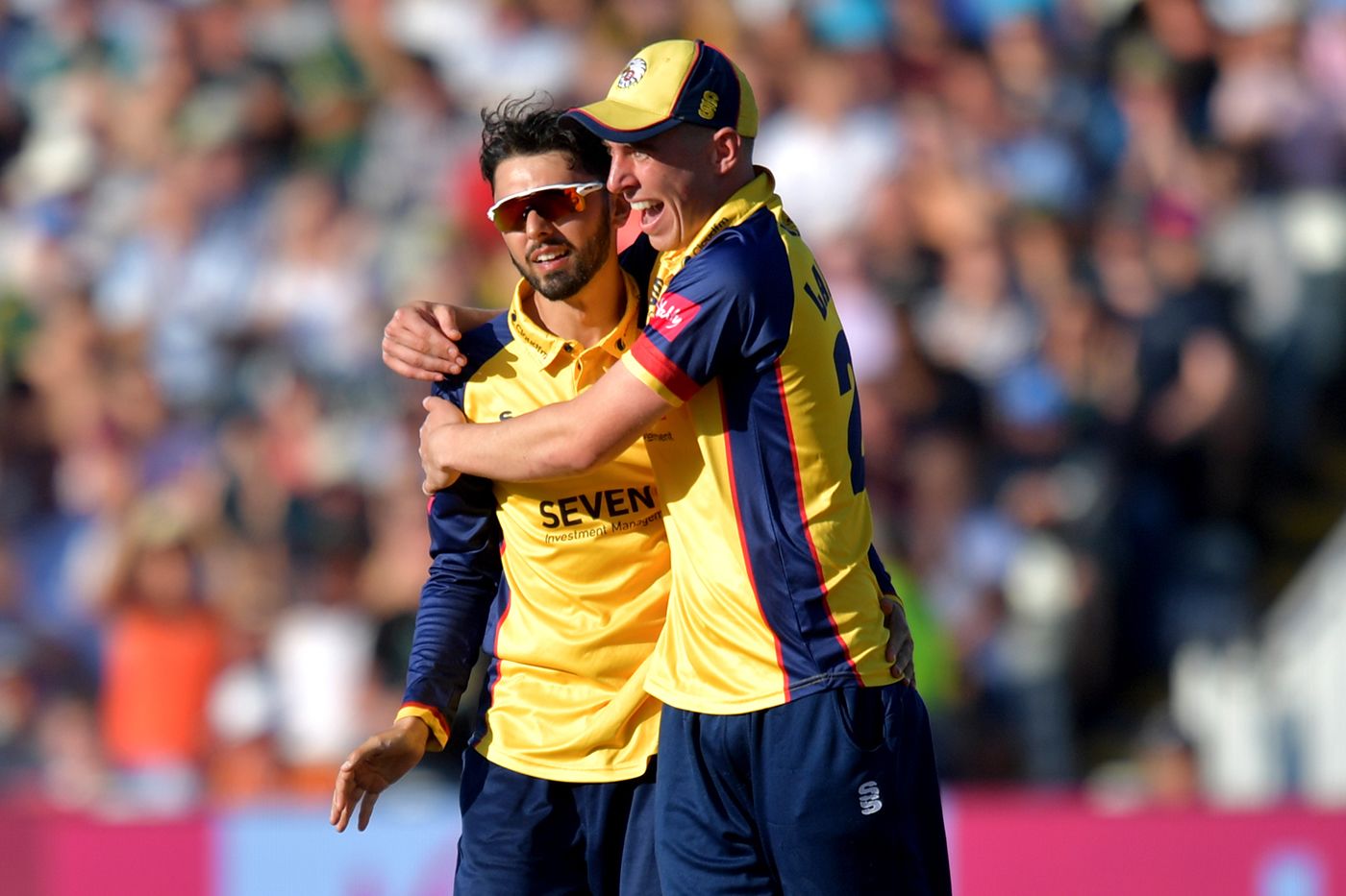 Aron Nijjar gets a hug from Dan Lawrence