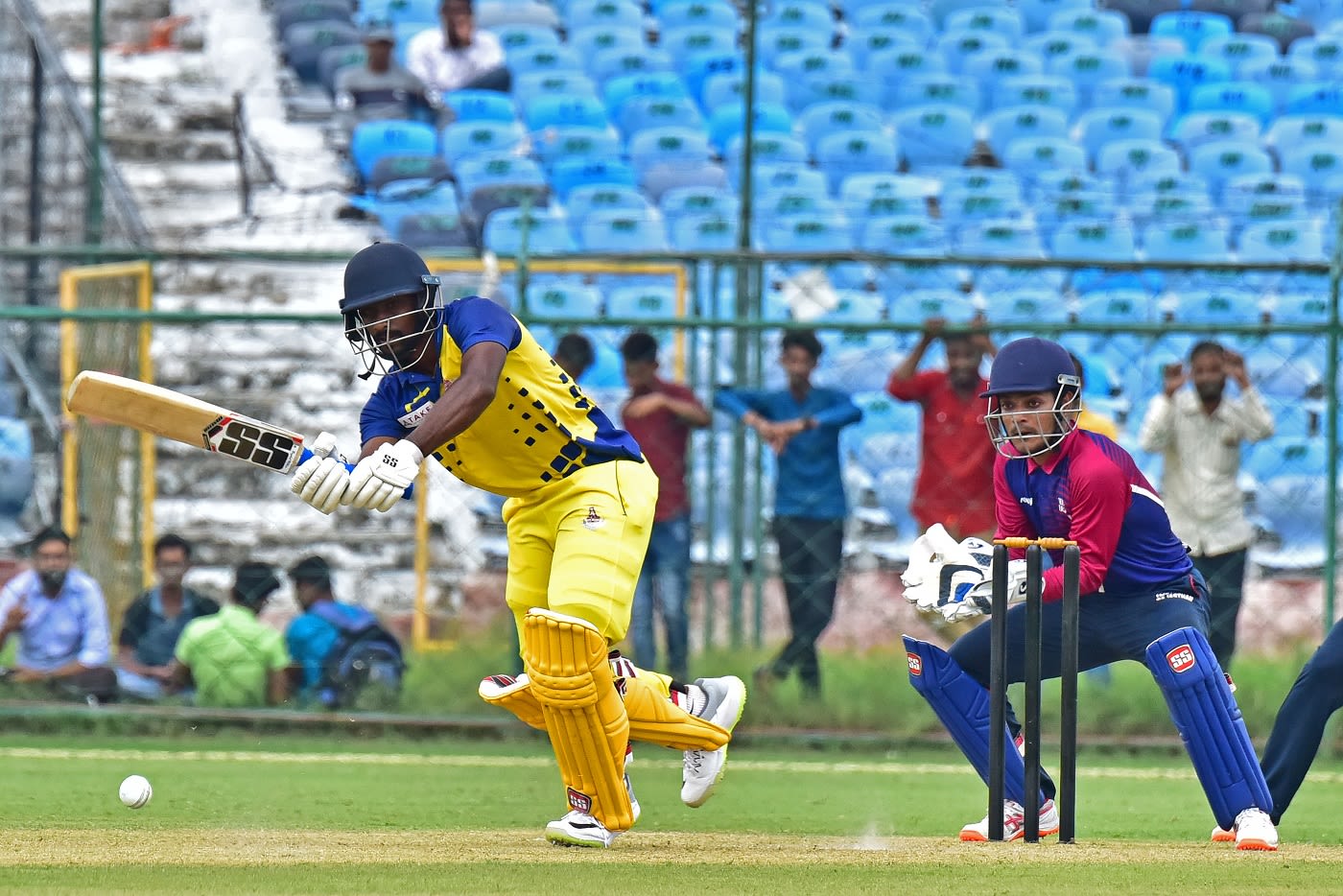 Baba Aparajith works on the leg side as Chetan Bist looks on