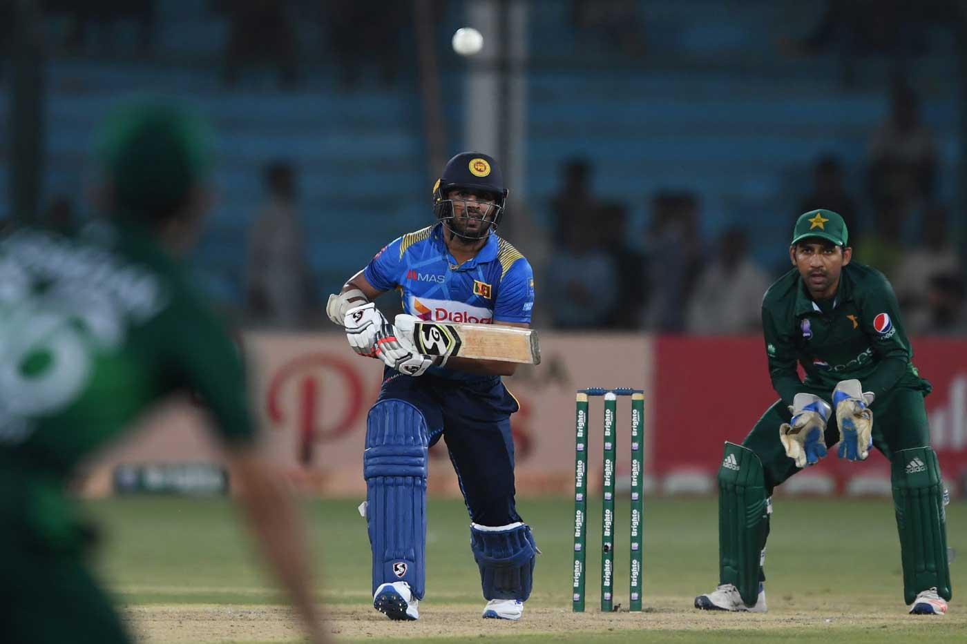 Shehan Jayasuriya drives down the ground
