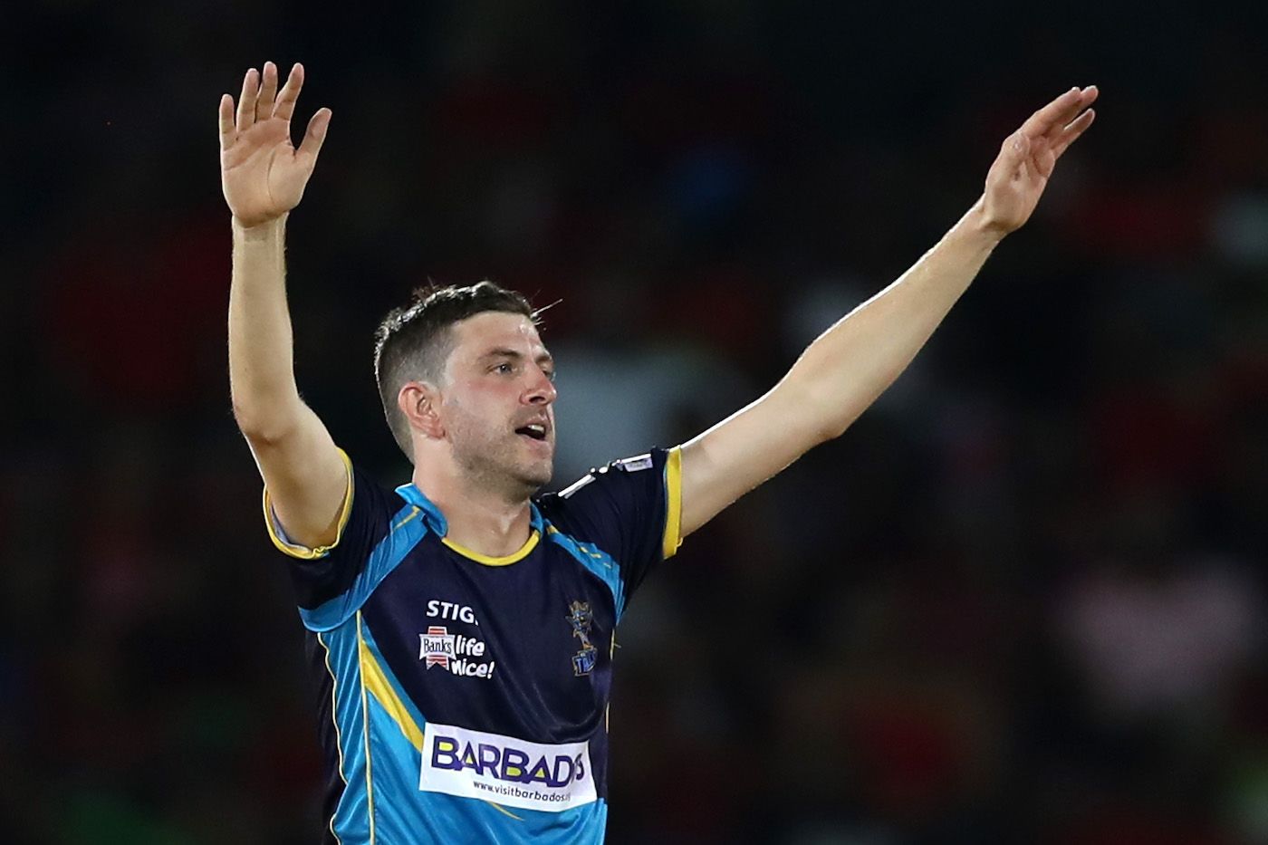 Harry Gurney celebrates during his economical spell