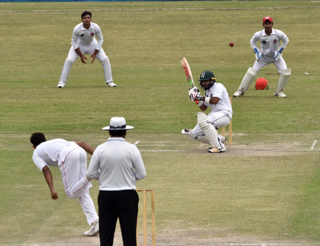 Hammad Azam ducks underneath a bouncer