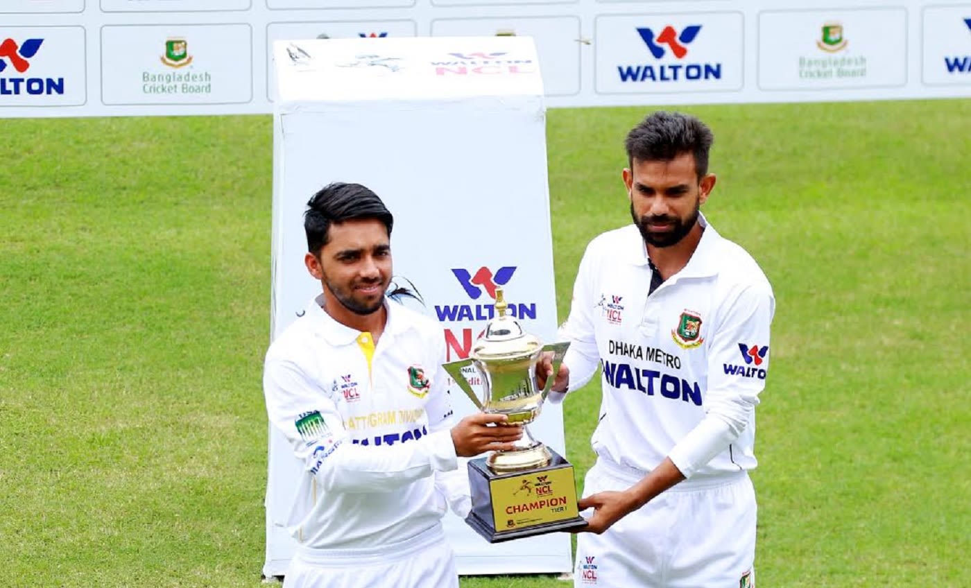 Mominul Haque and Marshall Ayub pose with the NCL trophy